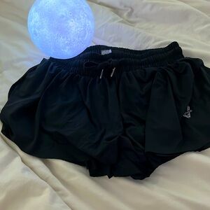 Black Luogongzi athletic flowy shorts.